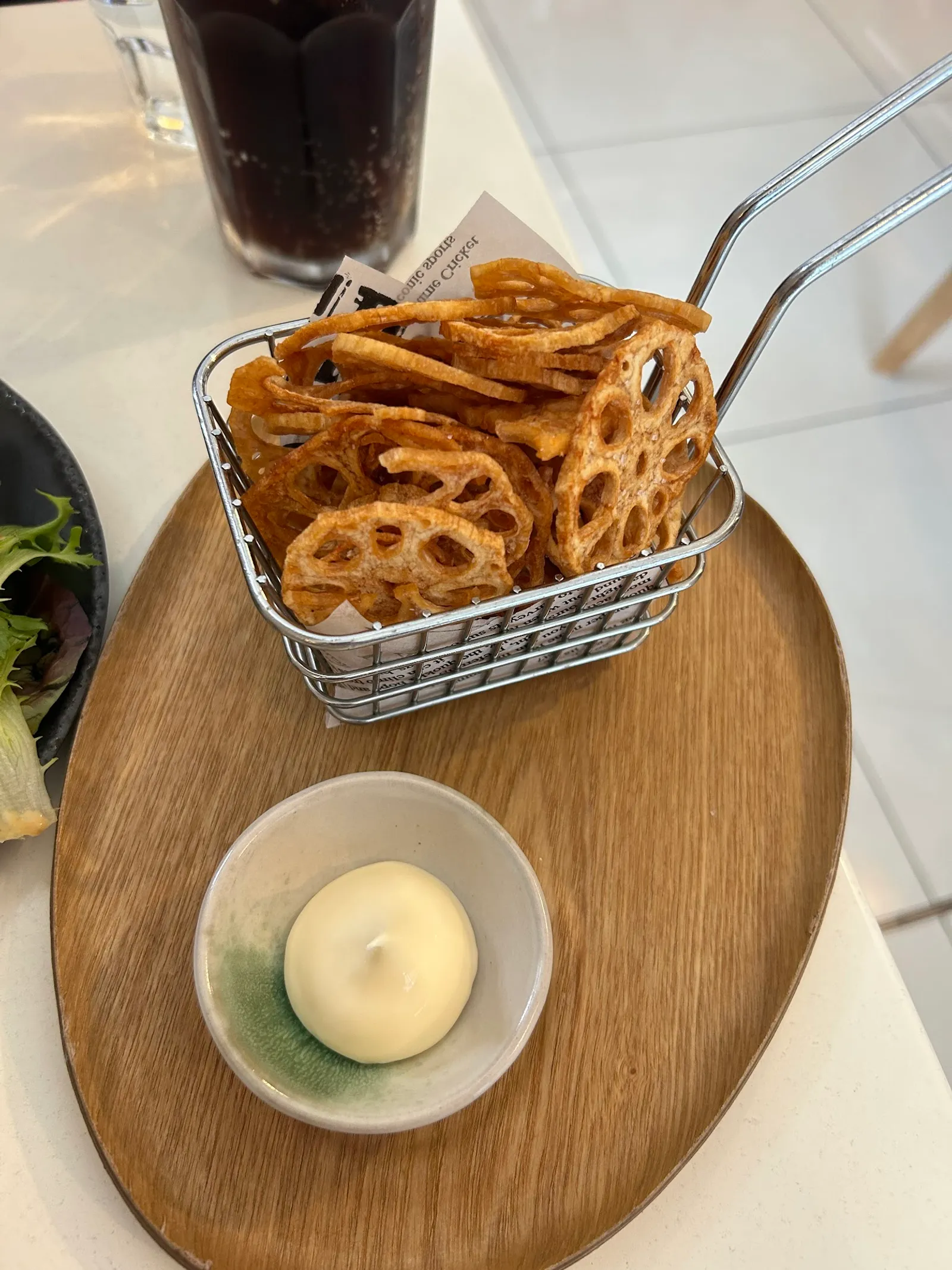 Renkon lotus root chips in wire basket with mayonnaise dipping sauce